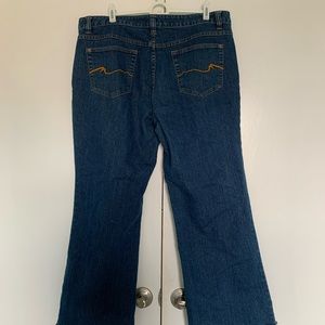 Nicole Miller brand slightly faded jeans with frayed hem